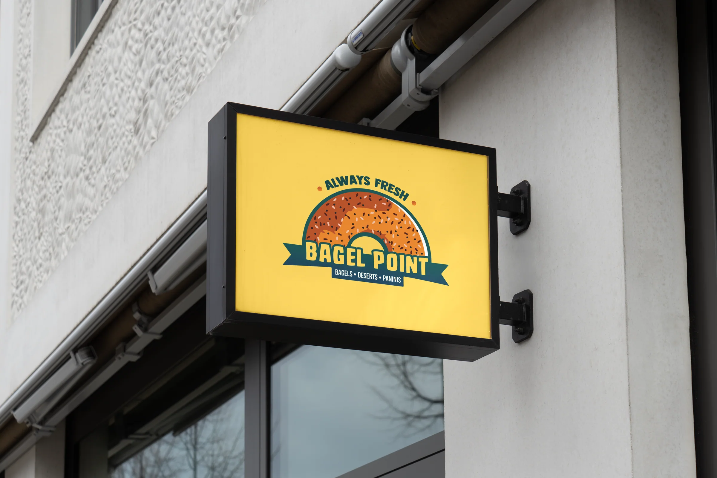 Bagel Point lightbox sign mounted on a shopfront